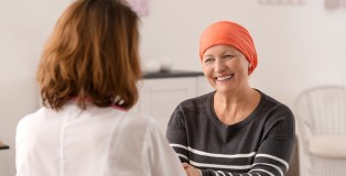 Mature woman with cancer visiting doctor in hospital - www.salonbusiness.co.uk