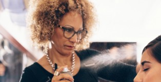 Hair stylist working on a woman 's hair at salon - www.salonbusiness.co.uk